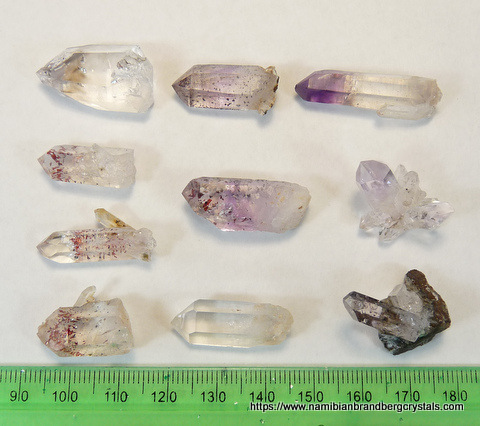 10 small quartz crystals from Brandberg, including harlequin and amethyst