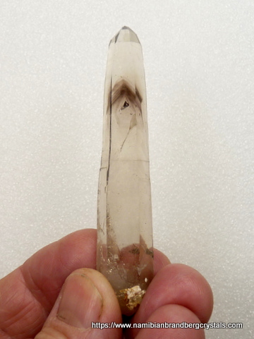 Light smoky phantom quartz crystal with beautiful crystal inclusion