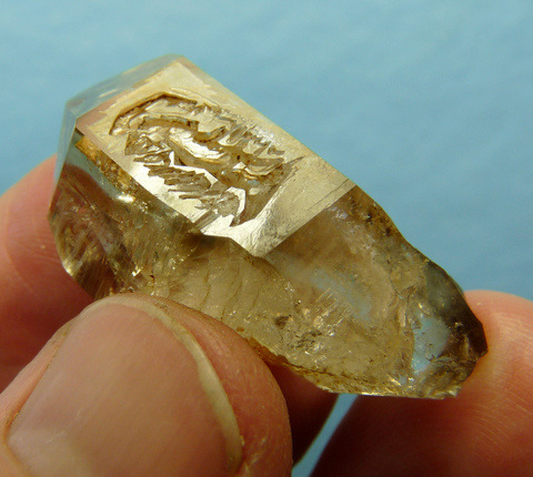 Beautiful light smoky window quartz crystal with negative crystal inclusion