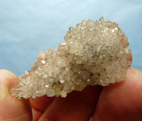 Quartz crystal with moving bubbles and light amethyst colouring