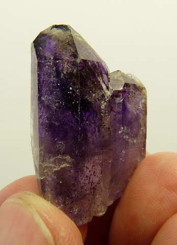 Amethyst quartz crystals with feldspar attached