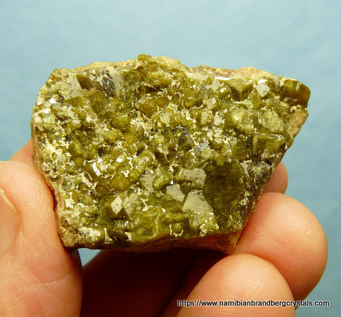 Demantoid garnets on feldspar matrix