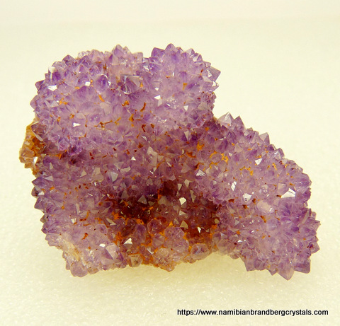 Small, drusy amethyst crystals on matrix
