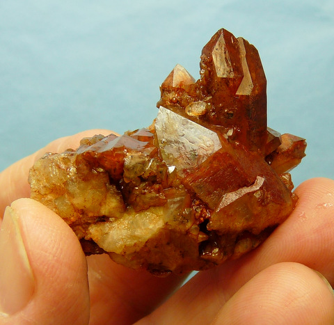 Quartz crystas with orangy-brown hematite colouring captured
