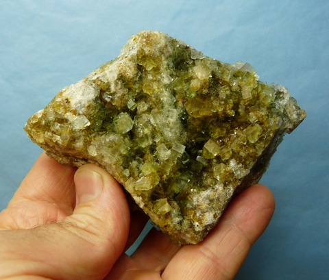 Beautiful yellowish-green fluorite crystals on rock matrix