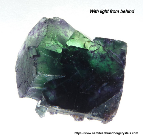 Dark green fluorite crystal cluster with bits of purple
